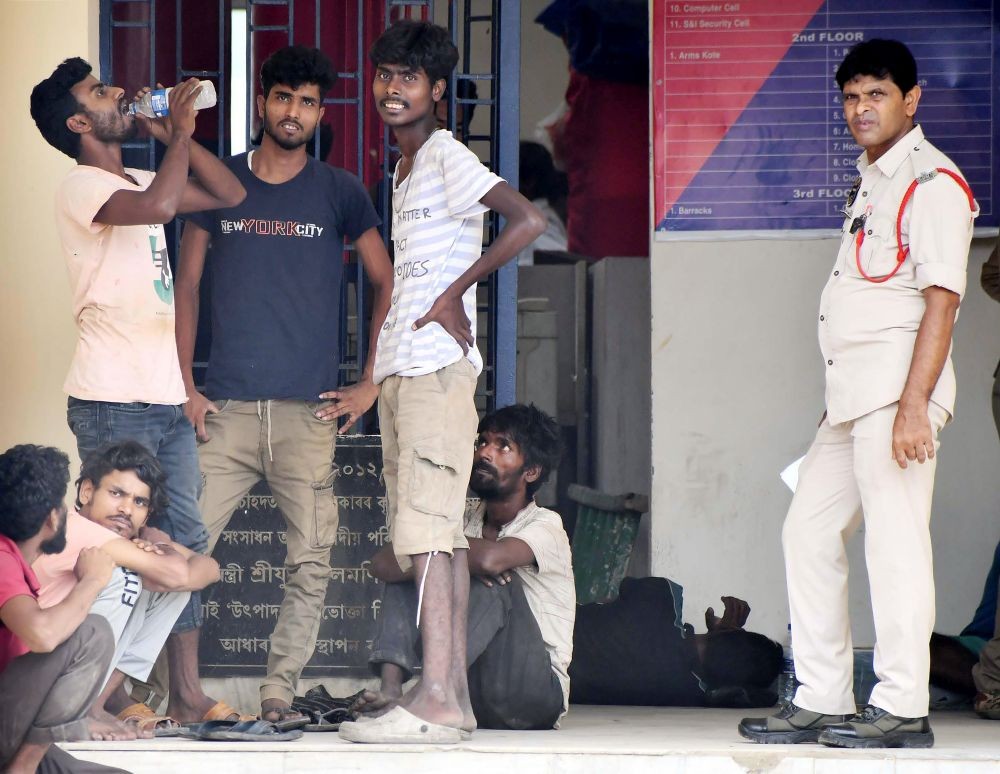 Suspected Bangladeshis are detained inside the Police Reserve for document verification, while police personnel stand guard in Guwahati, on May 26, 2025. (IANS File Photo)