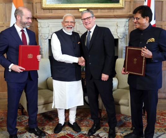 Prime Minister Narendra Modi shakes hands with UK Prime Minister Keir Starmer as Union Commerce and Industry Minister Piyush Goyal and UK Secretary of State for Business and Trade Jonathan Reynolds look on during the signing ceremony of the Comprehensive Economic and Trade Agreement (CETA), in Buckinghamshire on July 24, 2025. (IANS/PMO File Photo)