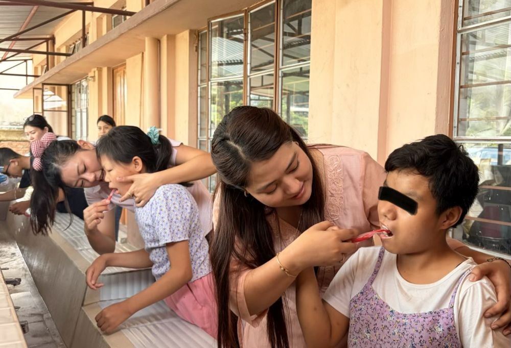 Members of the Nagaland Paediatric Dentists team demonstrate proper tooth-brushing techniques to children during an oral health outreach programme at Angel Home, Dimapur, on June 25.