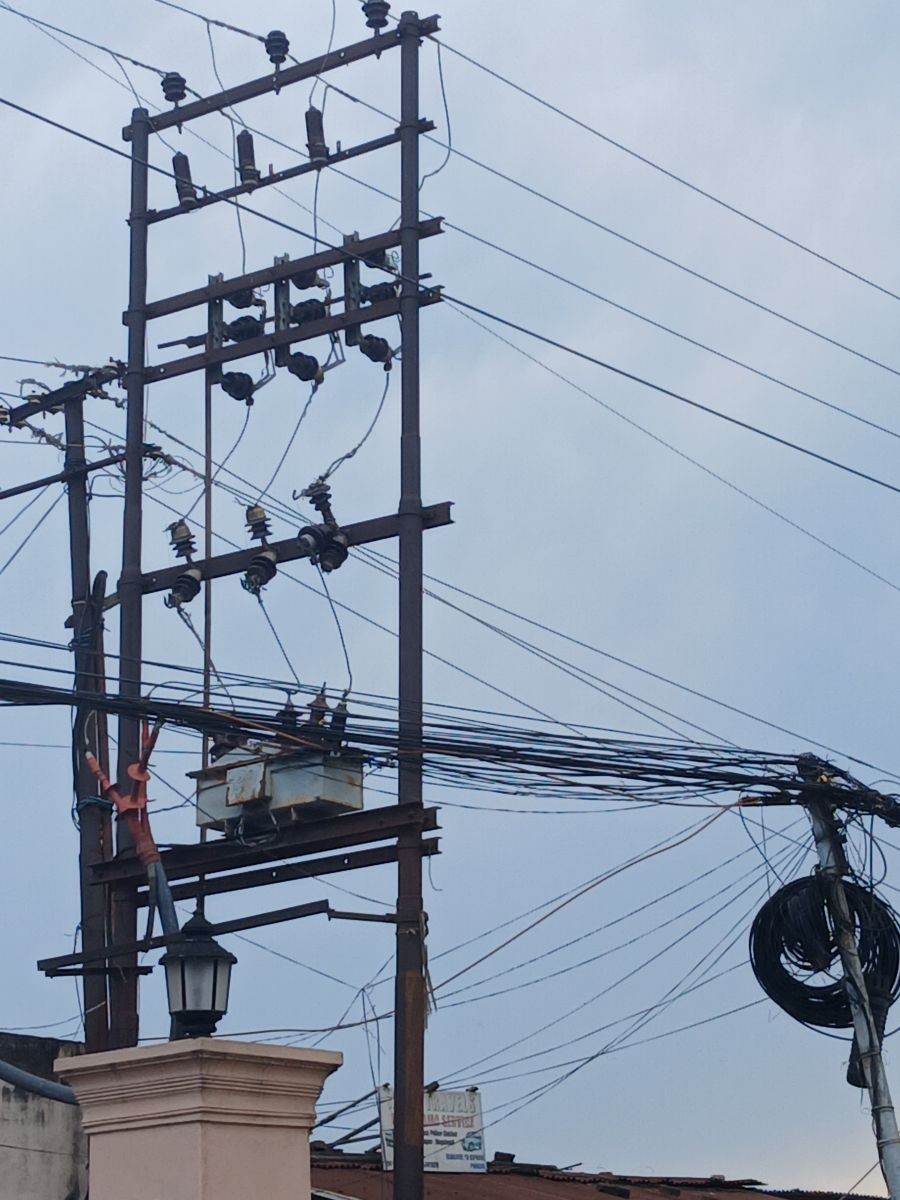 A power distribution pole carrying multiple electricity and communication lines in Dimapur. (Morung File Photo)