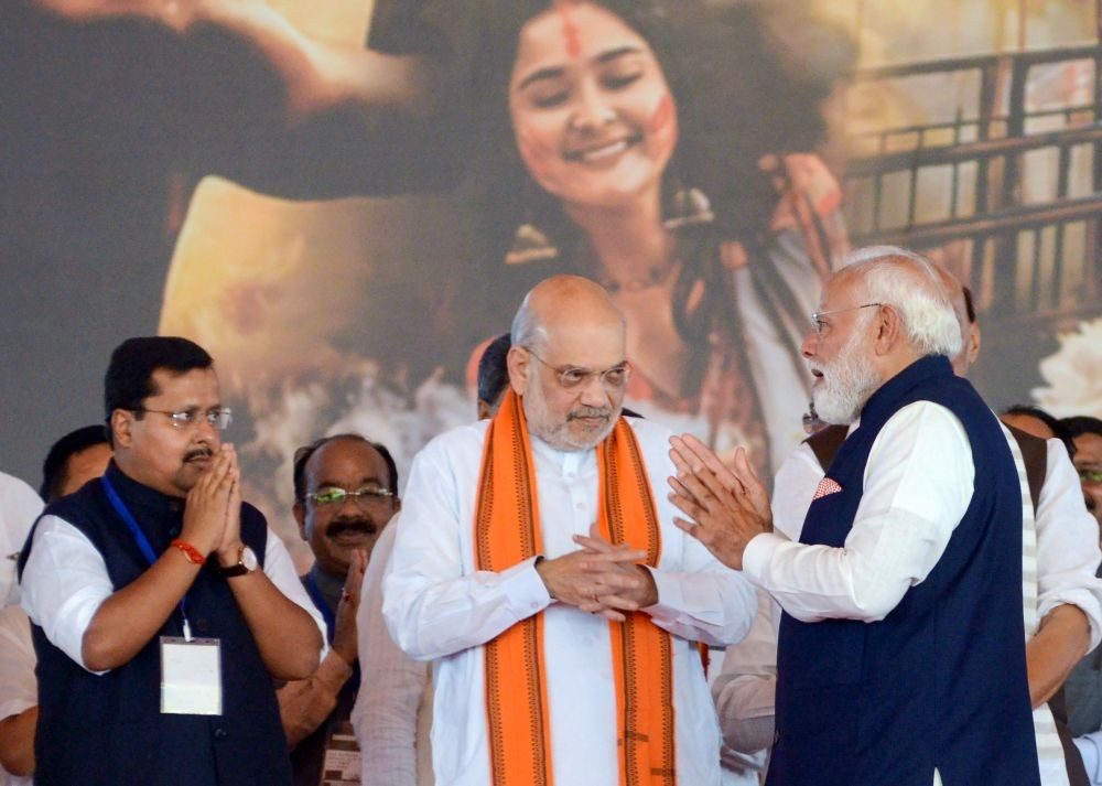 Prime Minister Narendra Modi with Union Home Minister Amit Shah and BJP National President and MP Nitin Nabin during the swearing-in ceremony of West Bengal Chief Minister-designate Suvendu Adhikari in Kolkata on May 9, 2026. (IANS File Photo)