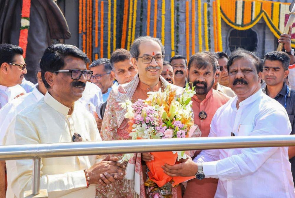 Shiv Sena (UBT) leaders Arvind Sawant and Sachin Ahir along with others, greet Shiv Sena (UBT) chief Uddhav Thackeray at the statue of Chhatrapati Shivaji Maharaj on the occasion of Shiv Jayanti at Mumbai Airport in Mumba. (IANS/X/@ShivSenaUBT File Photo)