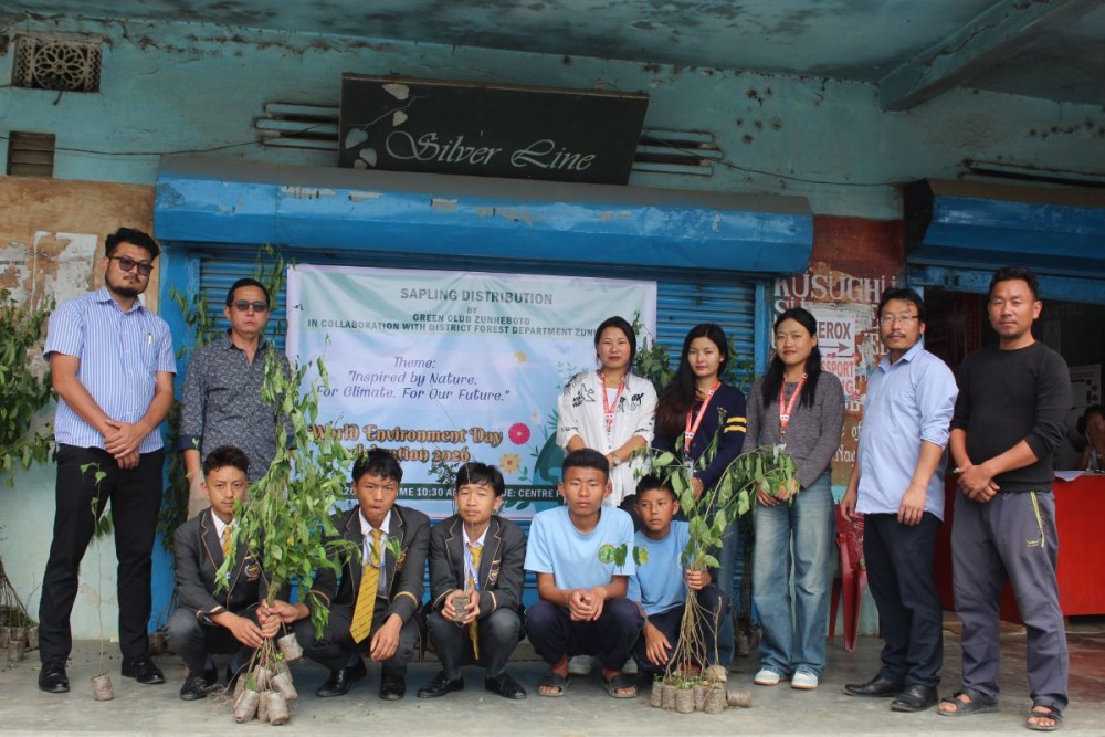 Green Club Zunheboto President Tavinto K Sumi along with others during a sapling distribution programme at Center Point, Zunheboto on June 4. (Morung Photo)