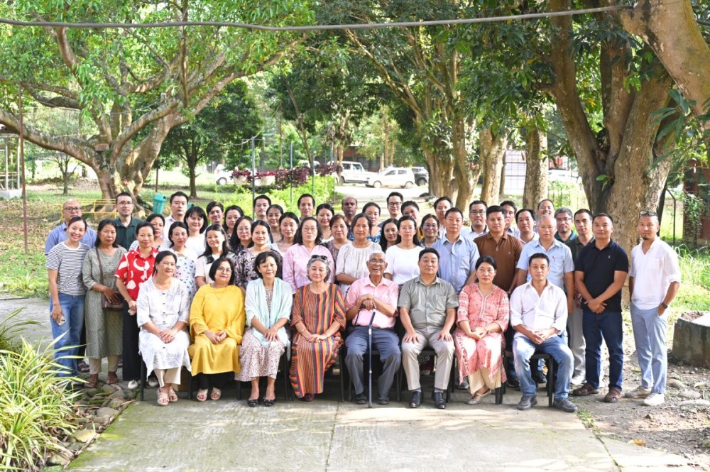 Tiakhala J Shimray with Principal Emeritus Rev Dr TA Shishak (4th right) and faculty-staff of Patkai Christian College.