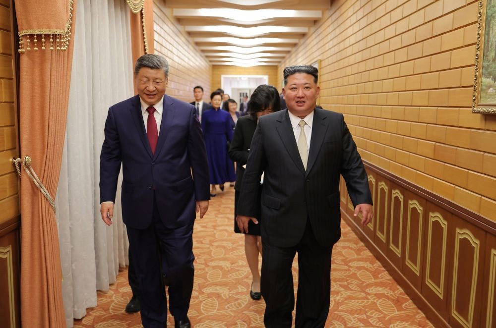 North Korean leader Kim Jong-un (R) and Chinese President Xi Jinping walk following a concert welcoming the Chinese leader at a gymnasium in Pyongyang on June 8, 2026, in this photo released by the North's official Korean Central News Agency. (Yonhap via IANS Photo)