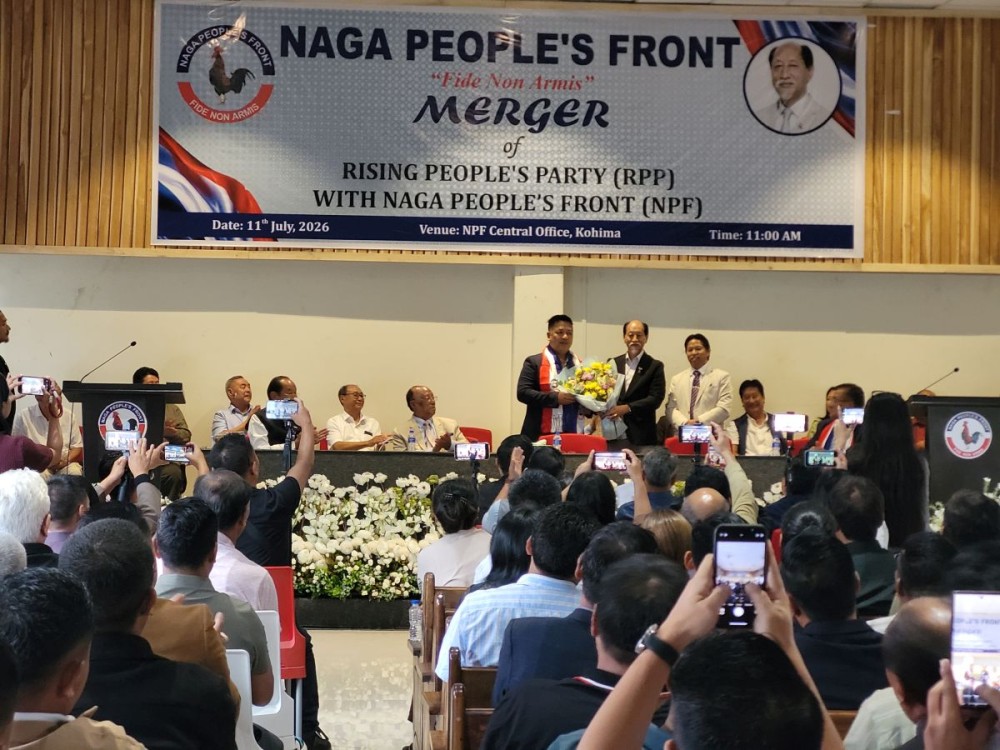 Chief Minister Dr Neiphiu Rio with Joel Naga and Achumbemo Kikon during the merger programme of RPP with NPF in Kohima on July 11. (Morung Photo)