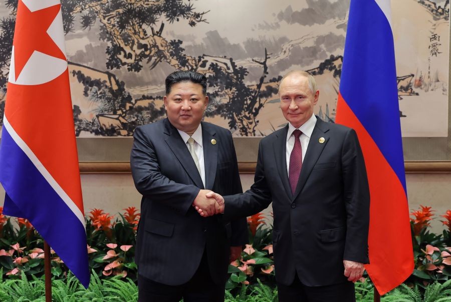 North Korean leader Kim Jong-un (L) shakes hands with Russian President Vladimir Putin ahead of their talks at the Diaoyutai State Guesthouse in Beijing on Sept. 3, 2025, in this photo released by the North's official Korean Central News Agency. (IANS/Yonhap File Photo)