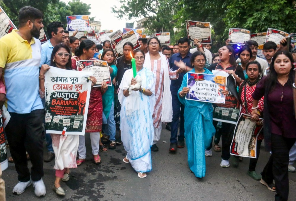 Kolkata: Trinamool Congress chairperson Mamata Banerjee, along with party leaders and supporters, takes part in a candle march from her residence in Kalighat to Hazra in protest against the alleged rape and murder of a minor girl in Baruipur, South 24 Parganas district, in Kolkata, West Bengal on Monday, July 6, 2026. (Photo: IANS)