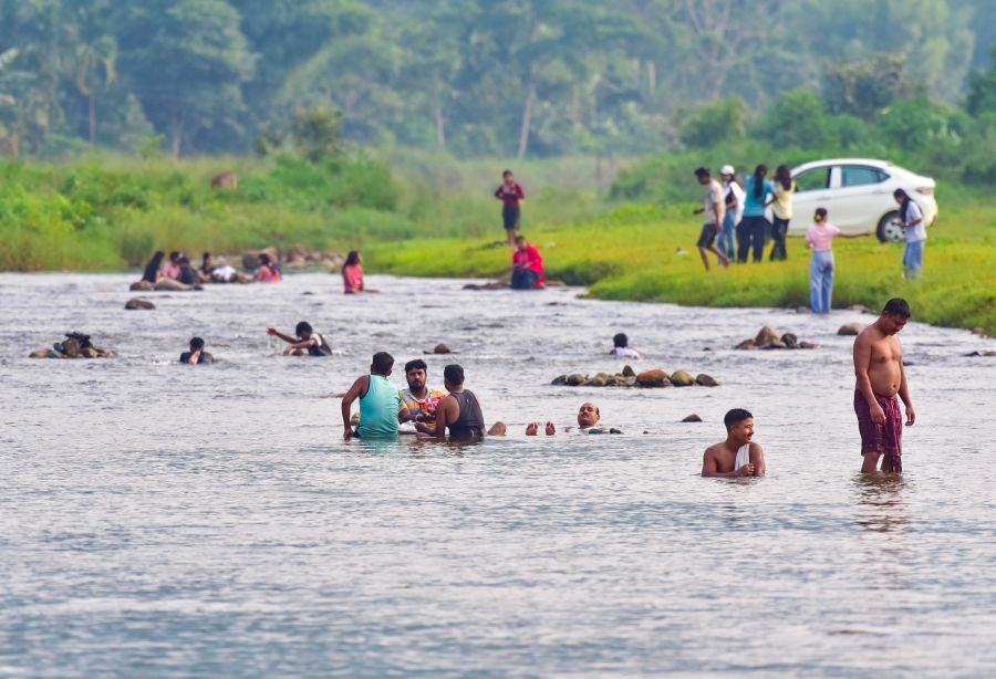 West Khasi Hills: People bathe in the Umshek River to get relief from the intense heatwave in the Rambrai-Jyrngam constituency of West Khasi Hills district, Meghalaya, along the Assam-Meghalaya border, on June 3, 2026. (IANS Photo)