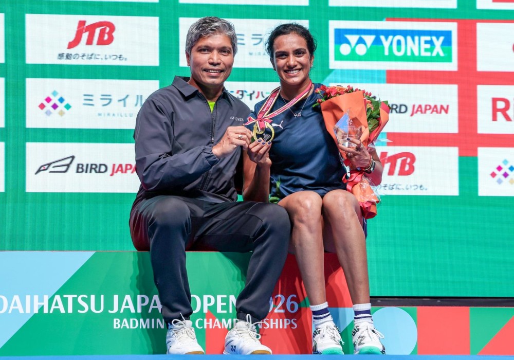 Tokyo: Pusarla V. Sindhu (R) poses a photo with her coach after winning the women's singles final match between Pusarla V. Sindhu of India and Yamaguchi Akane of Japan at the Japan Badminton Open 2026 in Tokyo, Japan, July 19, 2026. (Photo: Xinhua via IANS)