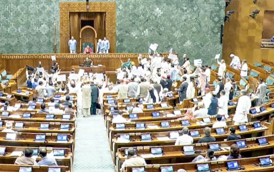 Opposition MPs shout slogans in the Lok Sabha during the monsoon session of Parliament in New Delhi on July 21, 2026. (IANS/Sansad TV Photo)