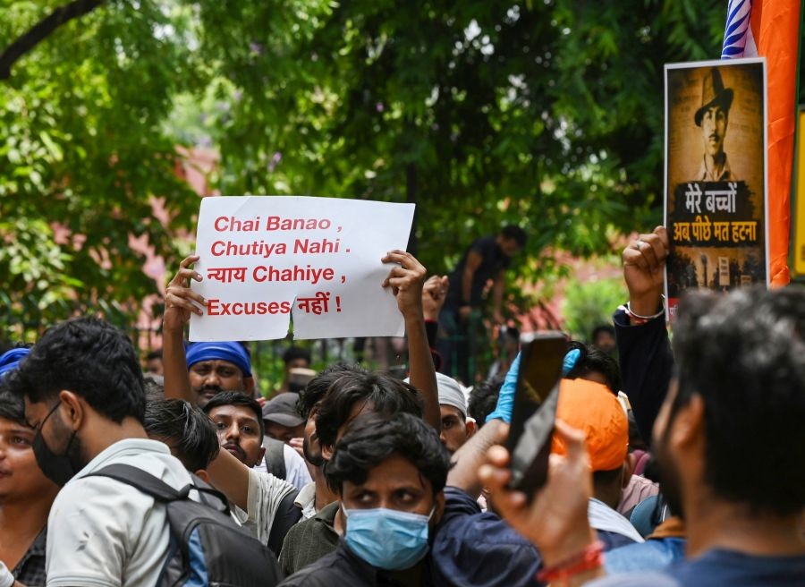Supporters of the Cockroach Janata Party hold placards and raise slogans during a protest demanding the resignation of Union Education Minister Dharmendra Pradhan over alleged examination irregularities at Jantar Mantar in New Delhi on July 23, 2026. (IANS Photo)