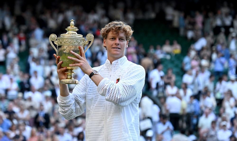 London: Jannik Sinner of Italy poses with his trophy after winning the men's singles final against Alexander Zverev of Germany at the Wimbledon Tennis Championships in London, Britain, July 12, 2026. (Photo: Xinhua via IANS)