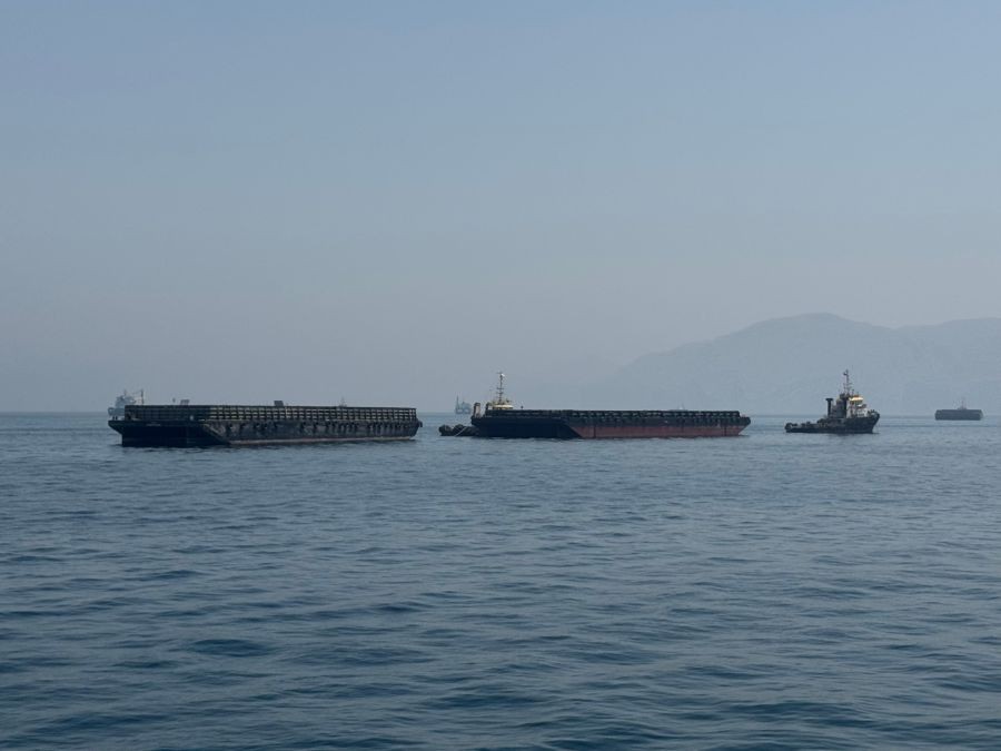 This photo taken with a mobile phone shows merchant vessels stranded in the waters of the Strait of Hormuz, near Khasab, a small town in northern Oman, May 29, 2026. (Xinhua via IANS File Photo)