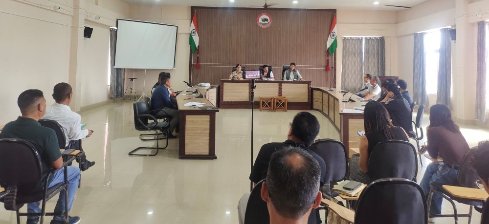 Deputy Commissioner Ajit Kumar Verma chairs the DDMA emergency meeting in Mokokchung on Tuesday to review flood relief in Tuli and road and other disruptions across the district. (Photo Caption)