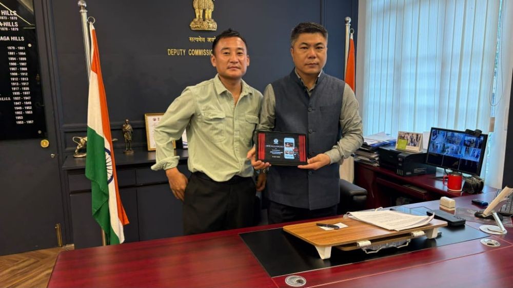 Kohima DC B. Henok Phom with Anato Sema during the inauguration of FoodWiFi food delivery app in Kohima on July 9.