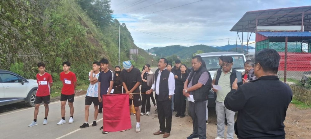 Zunheboto Town Council Deputy Chairperson Vihoto Zhimo flags off the annual Red Run Marathon in Zunheboto on July 22 to as part of a statewide campaign to raise awareness on HIV and STIs.  (Morung Photo)