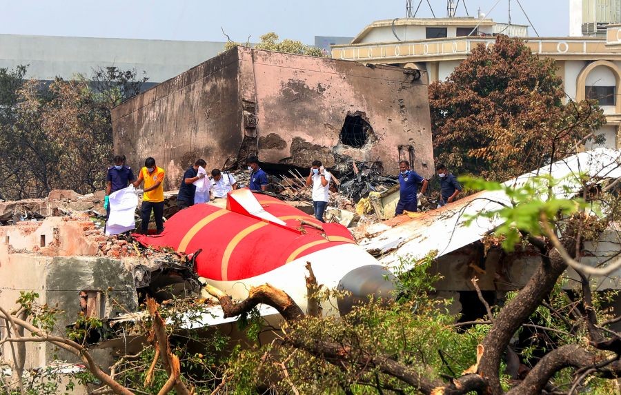 Efforts underway to remove the wreckage of the ill-fated Air India flight 171 that crashed and fell on the hostel mess of BJ Medical College, in Ahmedabad on June 14, 2025. (IANS File Photo)