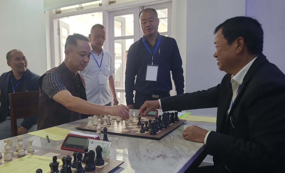 K Sekhamo and Er Vipulhou Lhoungu make ceremonial move for commencement of 22nd Nagaland State FIDE Rating Chess Championship 2026 in Kohima on July 16. (Morung Photo)