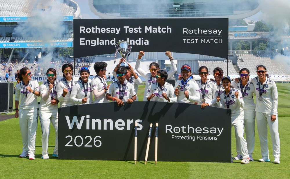 London: Members of the India Women's team pose with the winner's trophy after defeating England Women in the historic one-off Test at Lord's Cricket Ground in London, England, on Monday, July 13, 2026. (Photo: IANS)