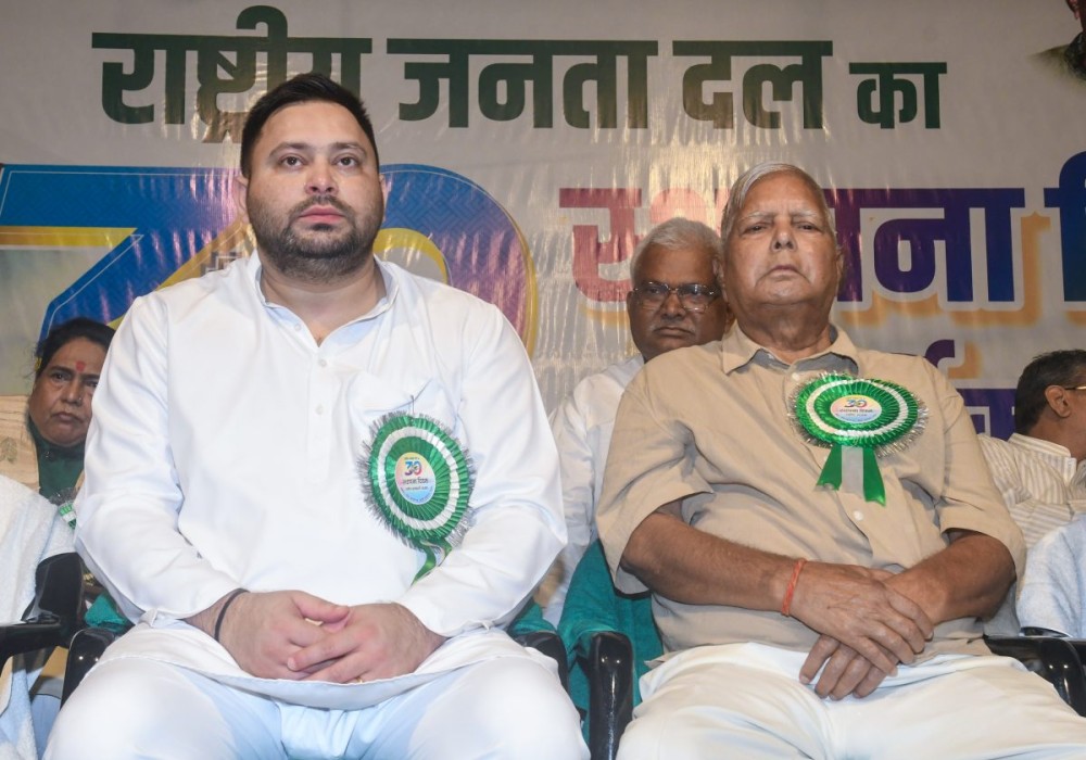Patna: RJD chief Lalu Prasad Yadav and RJD leader and Leader of Opposition Tejashwi Yadav during the party's 30th Foundation Day celebration in Patna on Wednesday, July 01, 2026. (Photo: IANS)