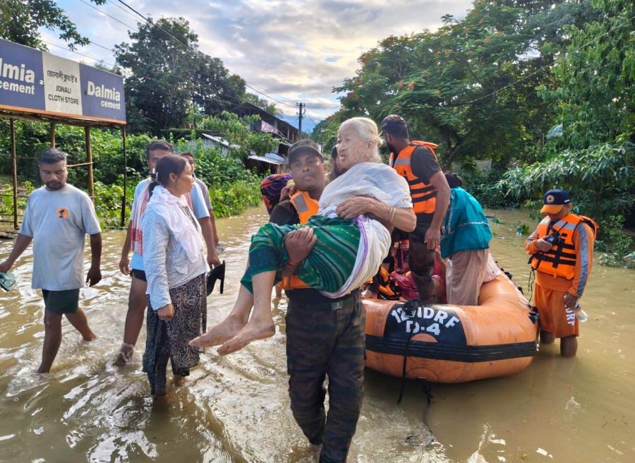 Indian Army personnel from the Red Shield Division of Spear Corps carry out rescue and relief operations amid widespread flooding in Sivasagar district of Assam on July 22. (IANS/X/@Spearcorps Photo)