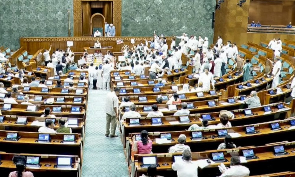 New Delhi: Opposition MPs shout slogans in the Lok Sabha during the monsoon session of Parliament in New Delhi on Monday, July 20, 2026. (Photo: IANS/Sansad TV)