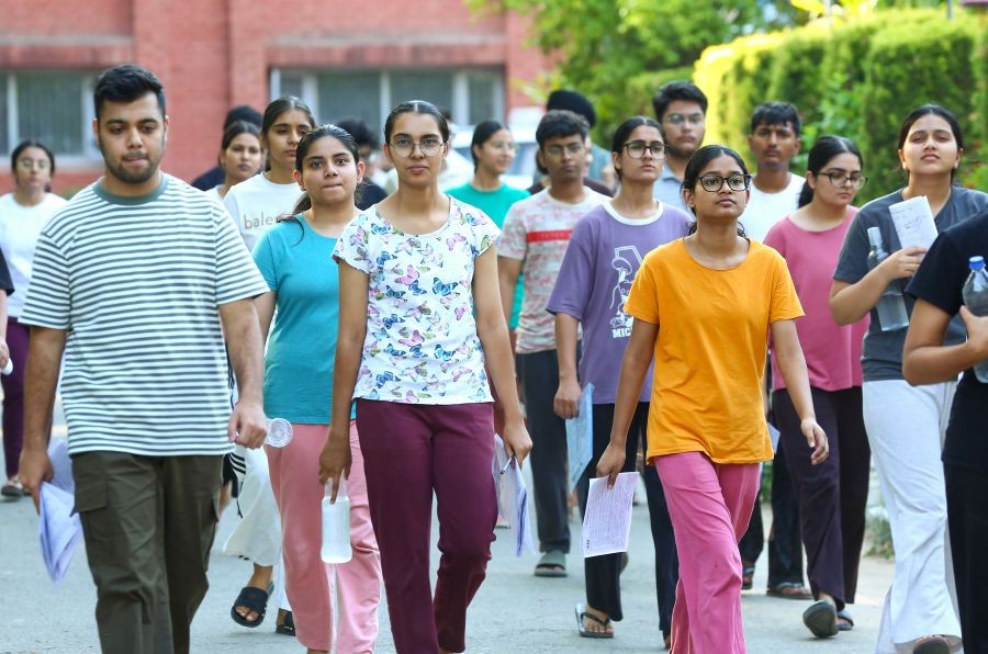Candidates exit an examination centre after appearing for the NEET 2026 re-examination, in Mohali on June 21, 2026. (IANS Photo)