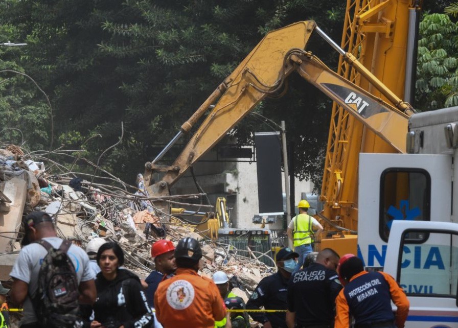 An excavator works on a collapsed building in Chacao, Venezuela, on June 28, 2026. (IANS Photo)
