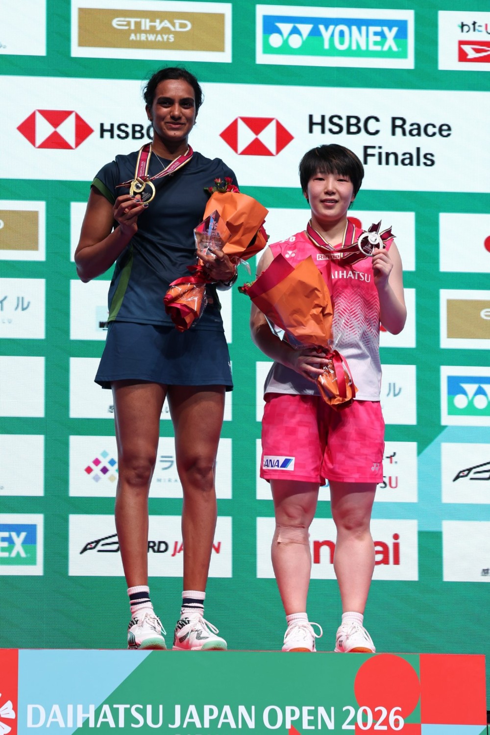 Tokyo: Pusarla V. Sindhu (L) poses for a photo with Yamaguchi Akane on the podium after winning the women's singles final match between Pusarla V. Sindhu of India and Yamaguchi Akane of Japan at the Japan Badminton Open 2026 in Tokyo, Japan, July 19, 2026. (Photo: Xinhua via IANS)
