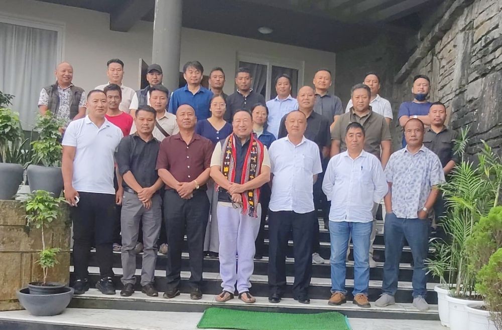 Kuzholuzo (Azo) Nienu with officials of PWUK in Kohima on July 18.