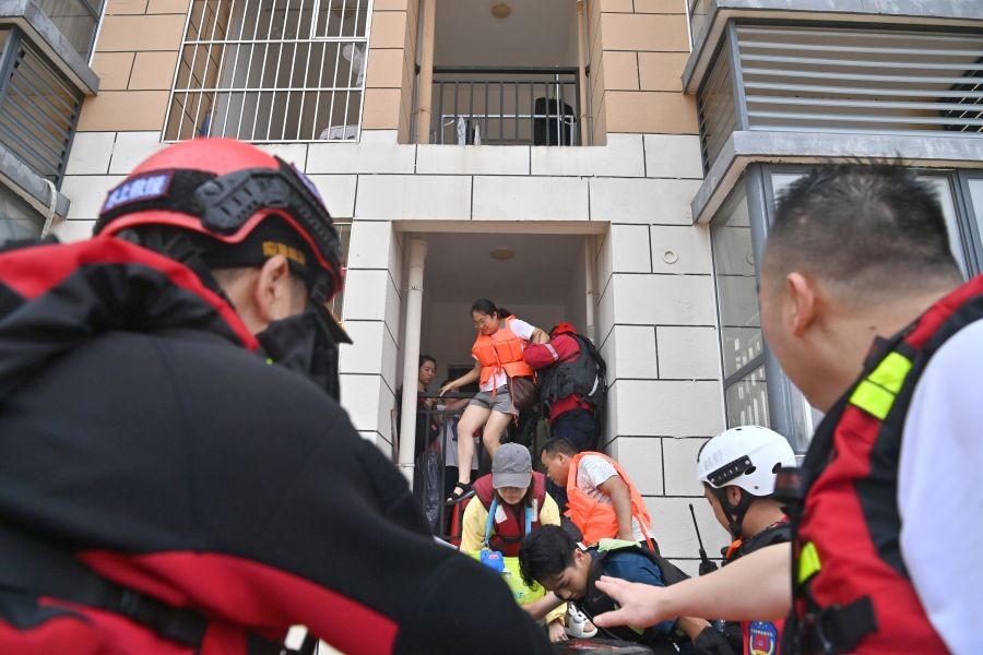 Rescuers evacuate stranded teachers and students at Xijiang education park in Guigang City, south China's Guangxi Zhuang Autonomous Region, July 8, 2026. The torrential rains caused by Typhoon Maysak left many school personnel and students trapped by floods at Xijiang education park in Guigang. Local authorities organized rescue forces to evacuate stranded teachers and students here on Wednesday. (Xinhua via IANS Photo)