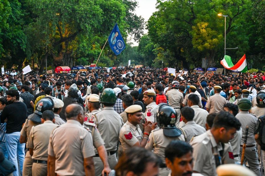 Security personnel stand guard as CJP supporters gather to stage a protest demanding the resignation of Union Education Minister Dharmendra Pradhan over the alleged NEET paper leak and examination irregularities, at Parliament Street in New Delhi on July 23, 2026. (IANS Photo)