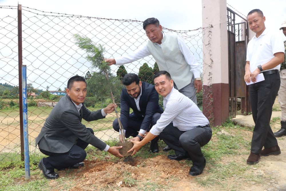 DC Zunheboto Dharam Raj, ZGC Principal Dr R Bendangtemjen, DFO Obed Bohovi Swu and others take part in a commemorative plantation of native trees as part of the Green Campus Initiative at Zunheboto Government College on August 12. (Morung Photo)