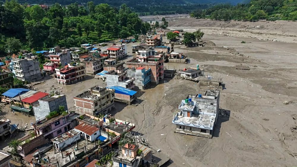 Houses lie buried under debris following devastating flash floods along the Trishuli River in Nuwakot district, Nepal, on August 26, 2026. (IANS Photo)