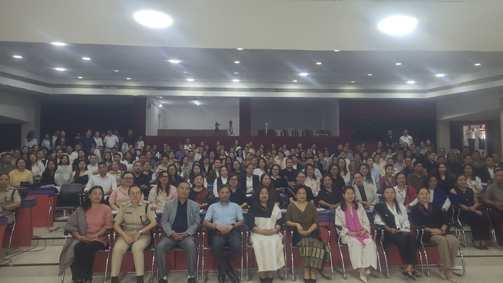 Rupin Sharma with social welfare department, NSLSA officials and participants of state level convergence meeting to address violence against women and children in Kohima on August 25. (Morung Photo)