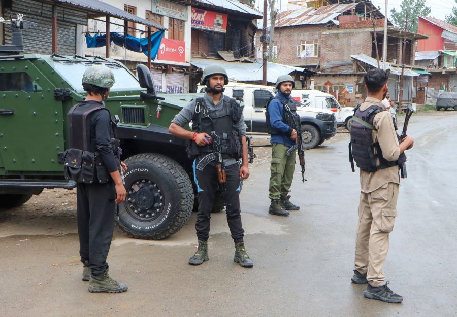 Security personnel stand guard during a search operation following a terrorist attack in the Kilam area of south Kashmir's Kulgam district, where two non-local labourers were killed, on August 1, 2026. (IANS Photo)