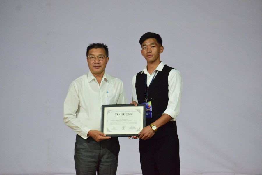 Kohima Science College (Autonomous), Jotsoma Principal Dr Temjenwabang receives a certificate of appreciation during the inaugural Inter-Collegiate Tournament 2026 on August 6.