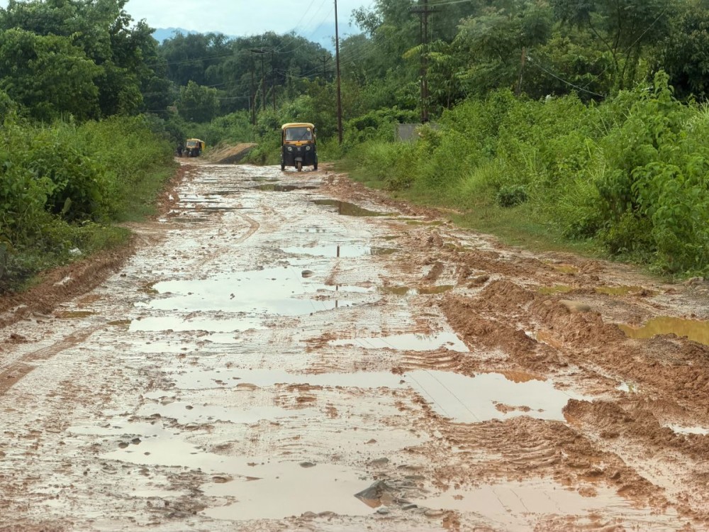 A mud-soaked stretch of the PMGSY road between Jalukie Town and Kamdi Bazaar, where monsoon rains have left the under-construction road riddled with slush and potholes.