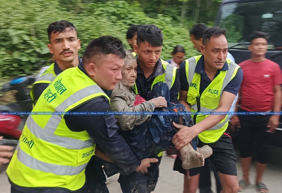 Nepal Police personnel carry an elderly woman to safety during rescue operations in the flood-affected Rasuwagadhi–Bhotekoshi area of Rasuwa district, Nepal, on August 28, 2026. (Nepal Police via IANS Photo)