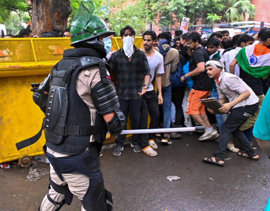 A policeman baton-charges supporters of the Cockroach Janta Party (CJP) during their ‘Chalo Sansad’ protest march towards Parliament near Jantar Mantar in New Delhi on July 20, 2026. (IANS Photo)