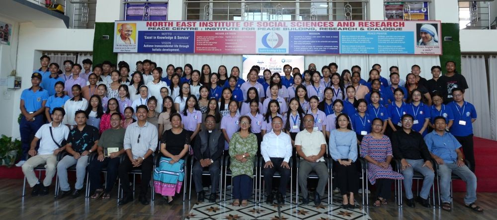 Faculty and students of NEISSR along with officials of Vitamin Angels during the singing of the MoU in Chümoukedima on August 1. (Photo Courtesy: NEISSR)
