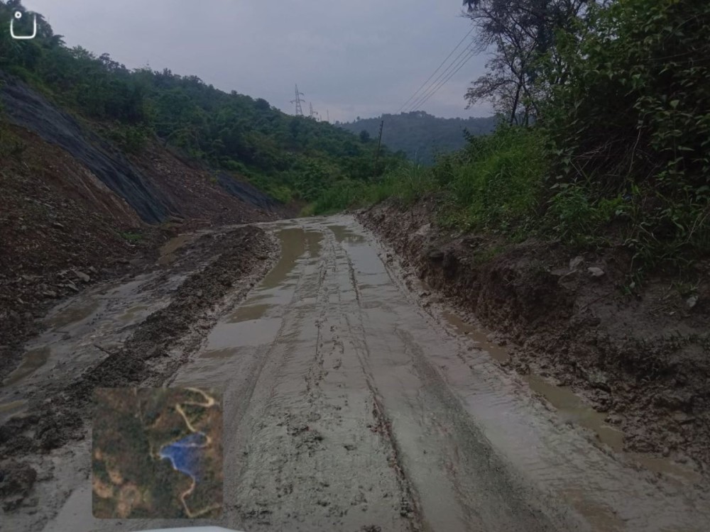 A muddy and waterlogged section of the under-construction NH-29 Package-II (Kikruma) along the Kohima–Jessami Road.