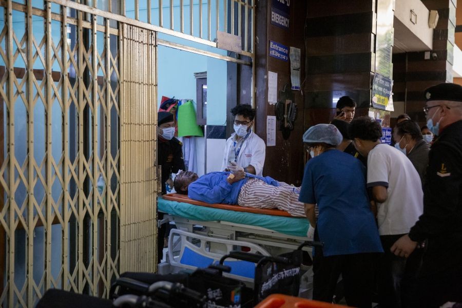 A person injured in a massive flash flood in north Nepal is taken to a hospital in Kathmandu, Nepal, Aug. 26, 2026. At least 95 people were killed and 484 others remain missing in a massive flash flood in north Nepal on the Office of the Prime Minister said. (Xinhua via IANS Photo)