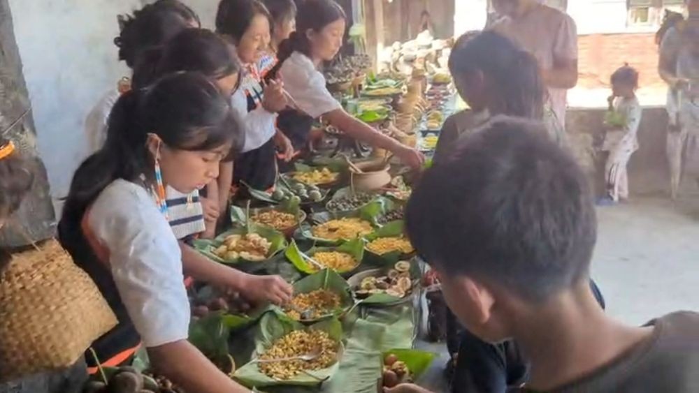 Young girls shares delicacies at Sako Nyenye at Porba on August 22.