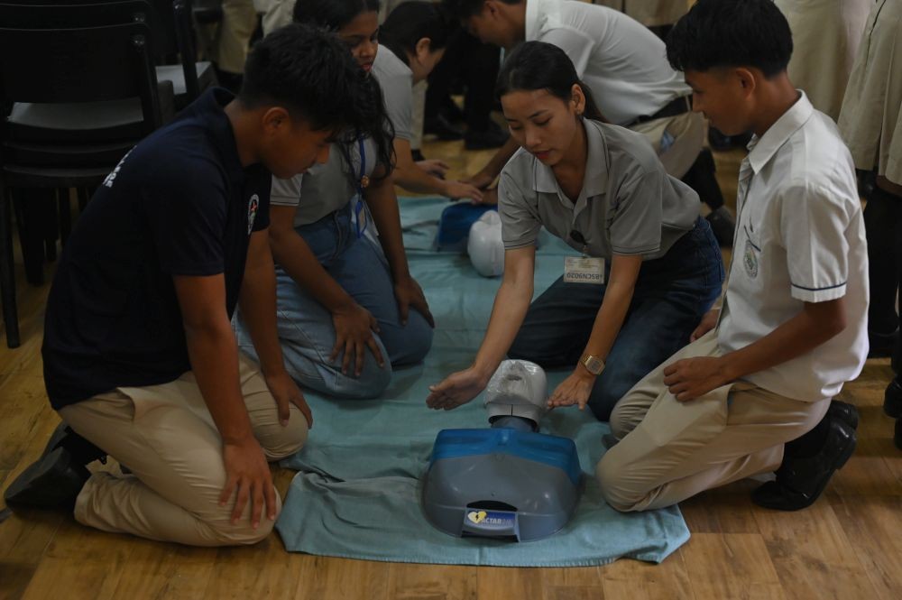 Students practise CPR on a training mannequin during a Basic First Aid and Basic Life Support workshop conducted by the CIHSR College of Nursing at the of Patkai Christian College (Autonomous) on on August 20. (Photo Courtesy: DJMC PCC)