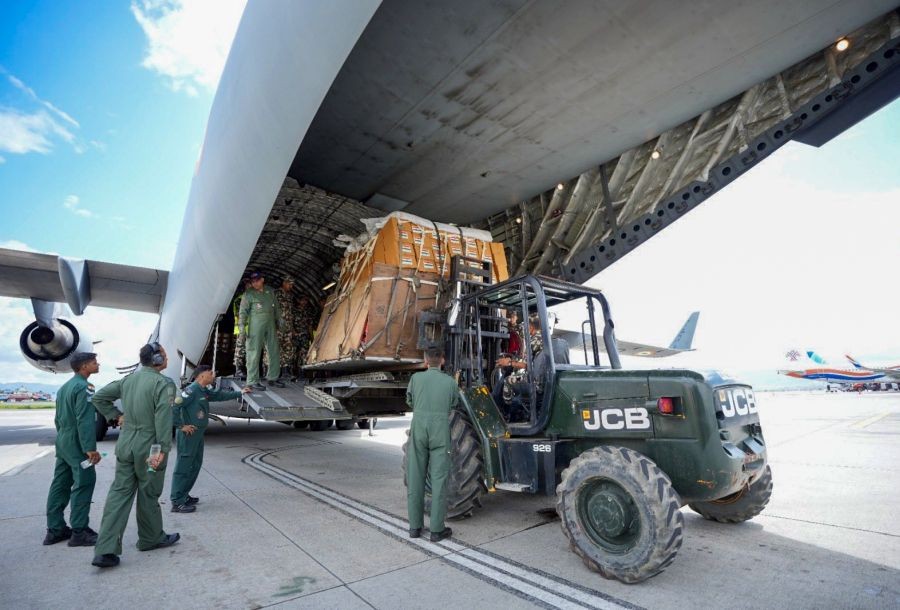 Security personnel unload humanitarian assistance and disaster relief (HADR) material, medicines and food packets sent by India from an Indian Air Force C-17 Globemaster aircraft to support relief and rescue efforts in flash flood-hit Nepal, in Kathmandu, on August 27, 2026. (IANS/X/@MEAIndia Photo)