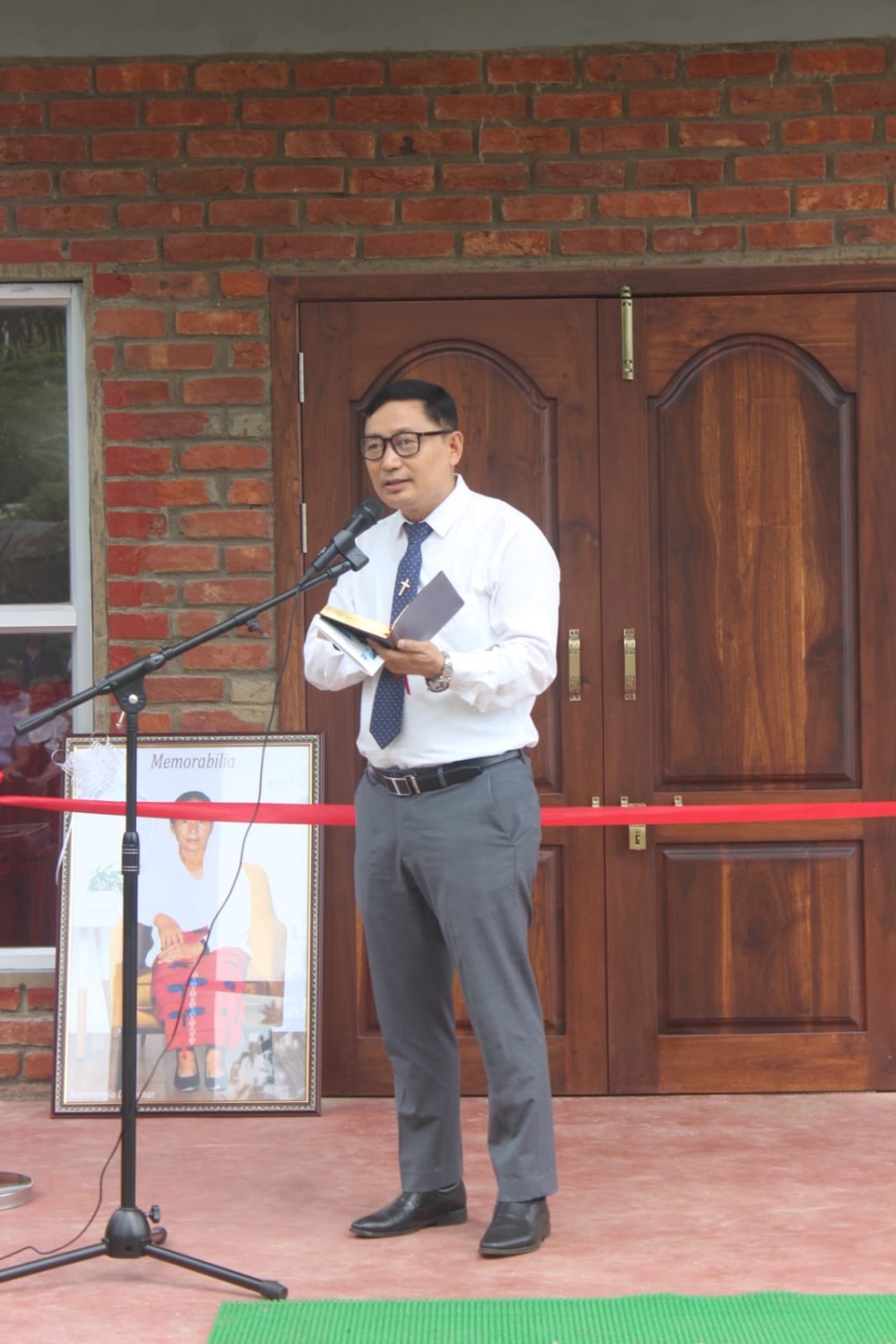 Rev Wati Kichu, Pastor of the Dimapur Ao Baptist Church (DABA), formally dedicates the Narosangla Chapel Hall on September 9 in Dimapur.