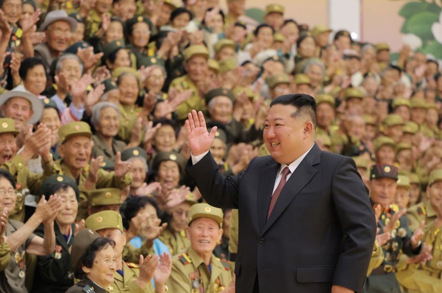 North Korean leader Kim Jong-un (C) waves to war veterans, who took part in the celebrations of the 73rd anniversary of the 1950-53 Korean War armistice, as he joins a photo session with them in Pyongyang on July 28, 2026, in this photo released by the North's official Korean Central News Agency. (Yonhap via IANS Photo)