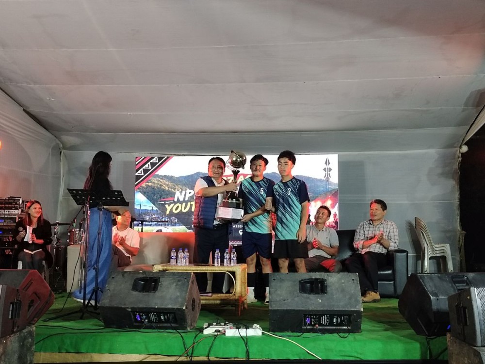 Metsübo Jamir, Minister for Rural Development and SIRD with the winners of the Futsal Championship during the 27 Mokokchung Town AC NPF Youth Wing Youth Festival at Mujabi Ground, Mokokchung, on September 17. (Morung Photo)